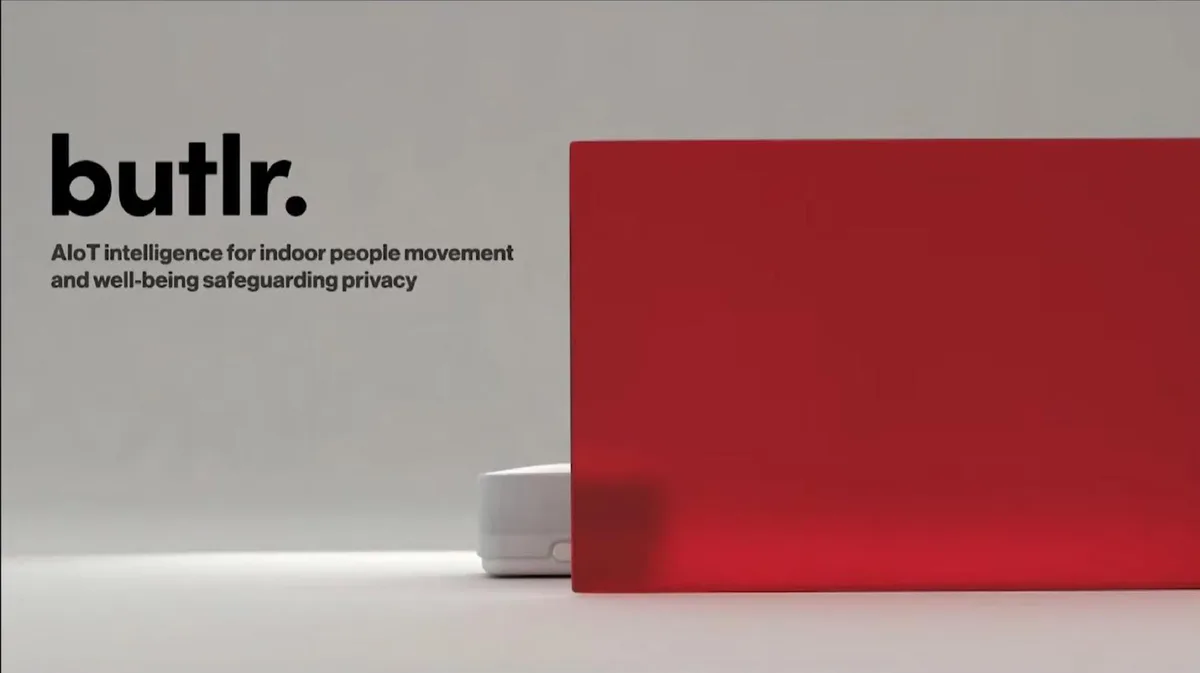 The slide features a minimalist design with the company logo and a tagline, alongside a product image partially obscured by a red translucent panel.
