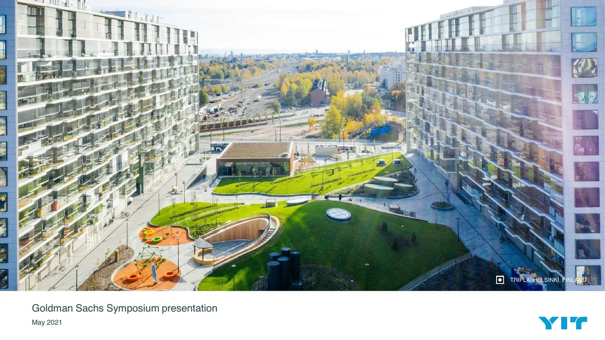 The slide features a large hero image of a real estate development project.