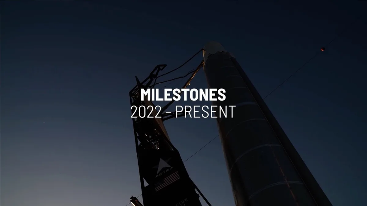 The slide features a high-contrast, atmospheric photograph of a rocket on a launch pad at dusk.