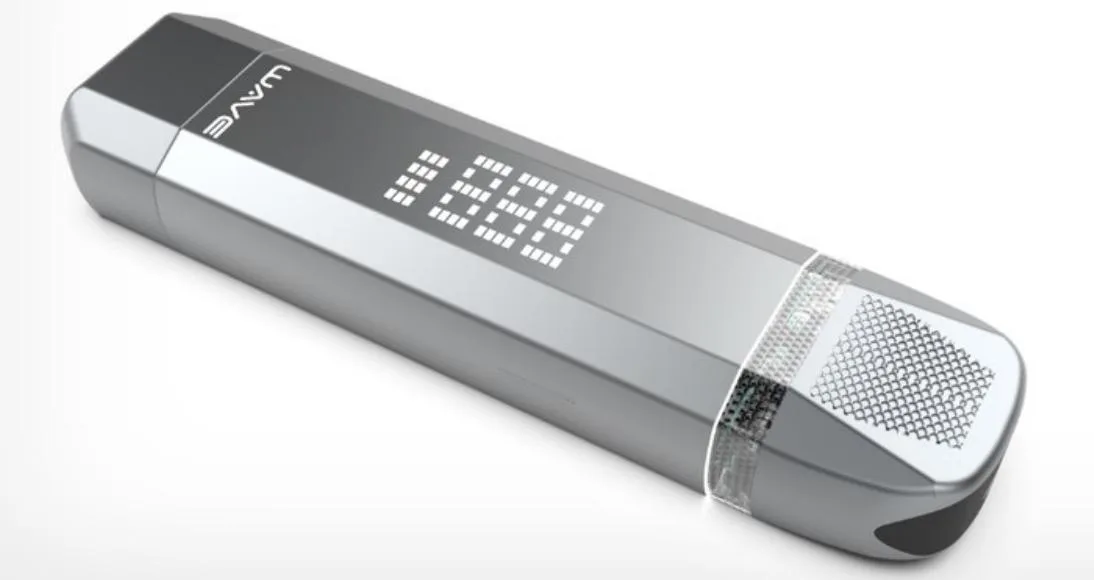 The image shows a sleek, metallic, handheld device with a digital display and a microphone/speaker grille.