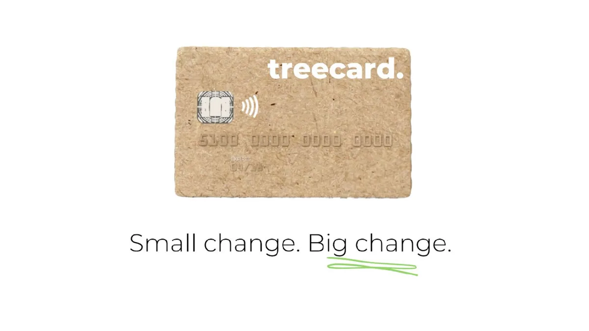 The card is made of wood, emphasizing the sustainability mission.