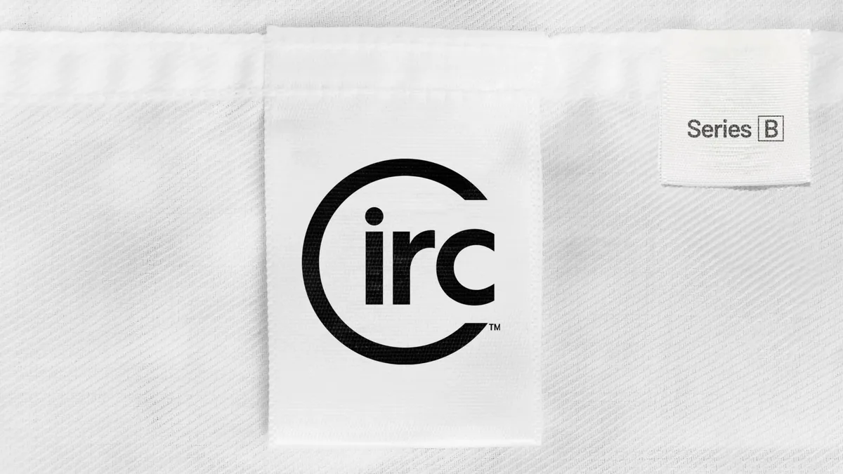 The visual metaphor of a clothing tag suggests the company is in the textile or fashion industry.