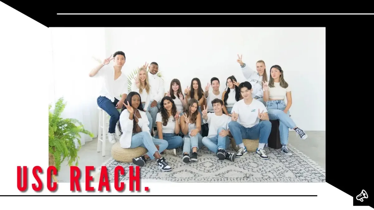 The slide features a large group of young adults posing for a photo, likely representing the team or community.